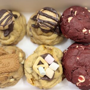 Assorted loaded cookies with chocolate drizzle, Biscoff topping and red velvet flavour, custom pre-order desserts in Ayr.
