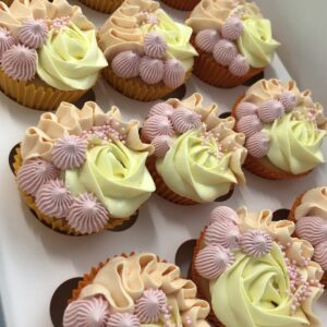 Custom vanilla buttercream cupcakes with pastel frosting swirls, perfect for birthdays and celebrations in Ayr